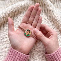Thumbnail for Thumb warming the rose gold octagon bracelet plate: the hidden photo appears under the thumb while the rest stays black | SKU: TPH-OCTB-ROSEGOLD-18