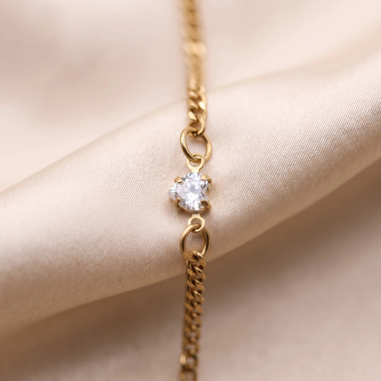 Heart Bond Matching Bracelet Set in Gold — close-up of the heart crystal in its four-prong setting, held by two jump rings