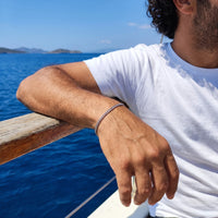 Thumbnail for Heart Bond Matching Bracelet Set in Silver — his bracelet worn on a sailing boat