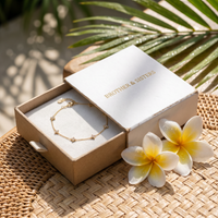 Thumbnail for Clover Charm Anklet in Brother & Sisters gift box on beach