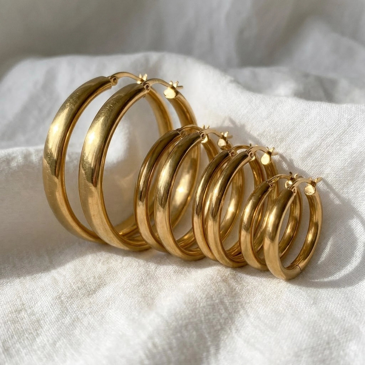 Huggie Hoop Earrings Set of 4 Pairs in Gold, macro detail of the metal and the finish | SKU: huggie-set-gold