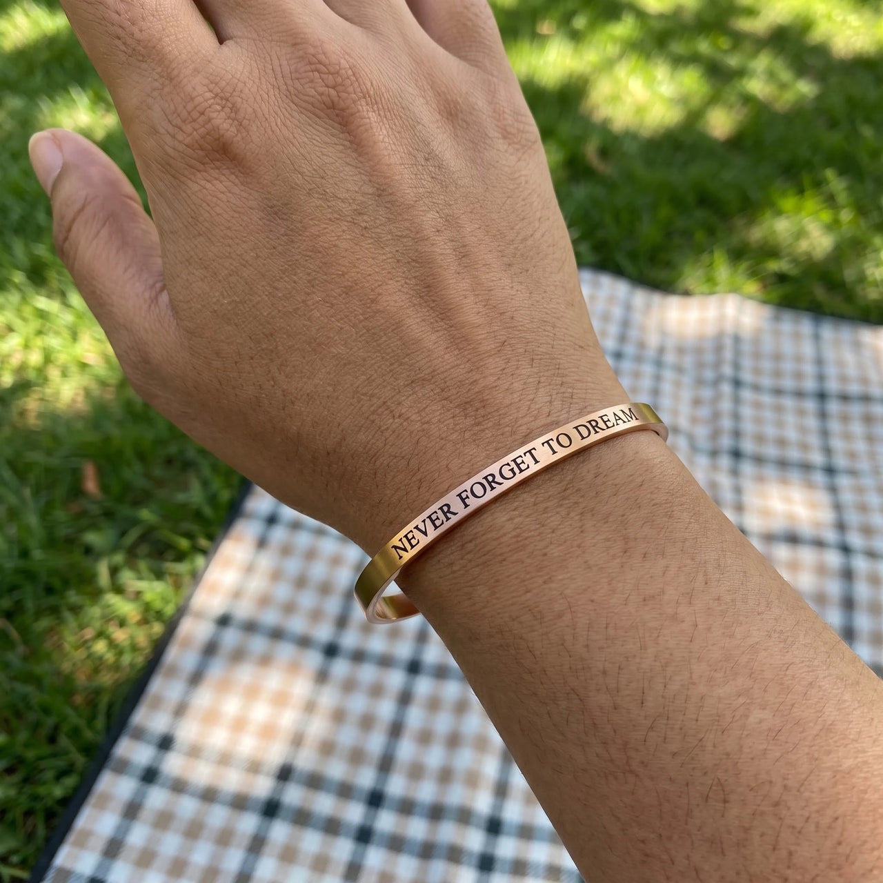 Never Forget To Dream bracelet in rose gold worn, showing its real size | SKU: nftd-rg