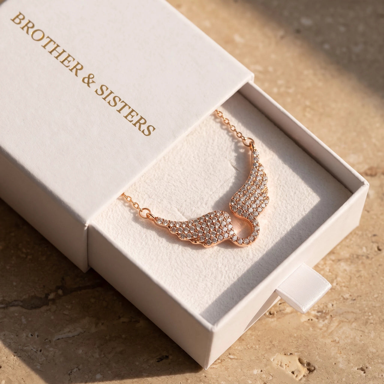 The rose gold necklace in the Brother & Sisters gift box | SKU: 42002-rose-gold