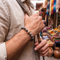 Thumbnail for Rose Gold Lion & Grey Stones Bracelet – held in a man's hand | Brother & Sisters | SKU: 20866222-rose-gold-XS-14-15, 20866222-rose-gold-S-16-17, 20866222-rose-gold-M-18-19, 20866222-rose-gold-L-20-21, 20866222-rose-gold-XL-22-23