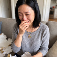 Thumbnail for Woman moved to tears after unwrapping the gold secret heart photo necklace | SKU: TPH-CHTN-GOLD-SMALL