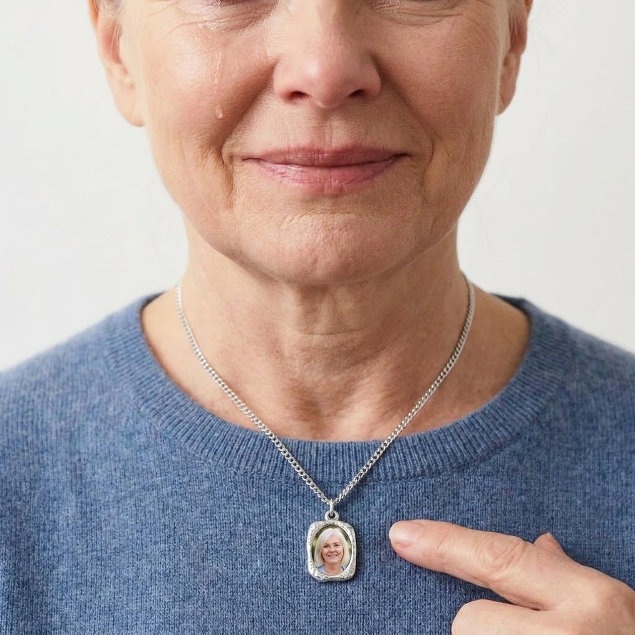 Woman moved as she wears her sister's photo in the silver oval necklace | SKU: TPH-OVLN-SILVER